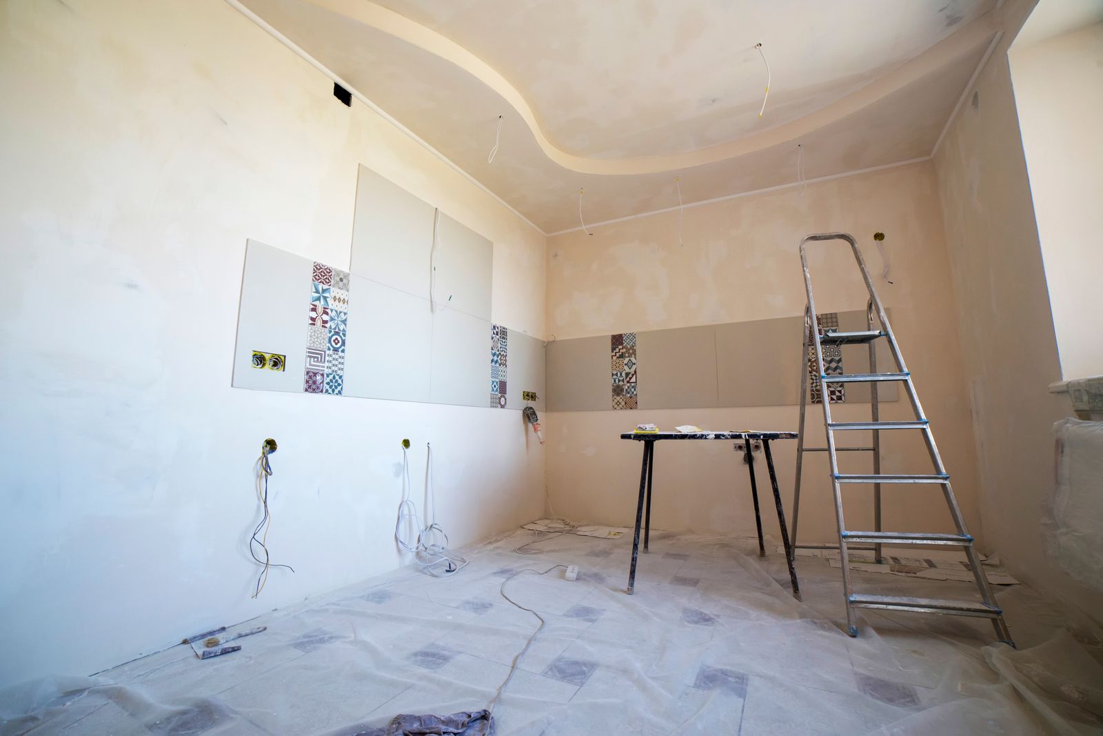 Room under construction with prepped walls and tile half installed
